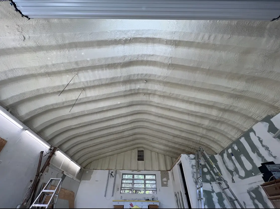 Spray polyurethane foam applied to the underside of a metal roof deck in East Orange